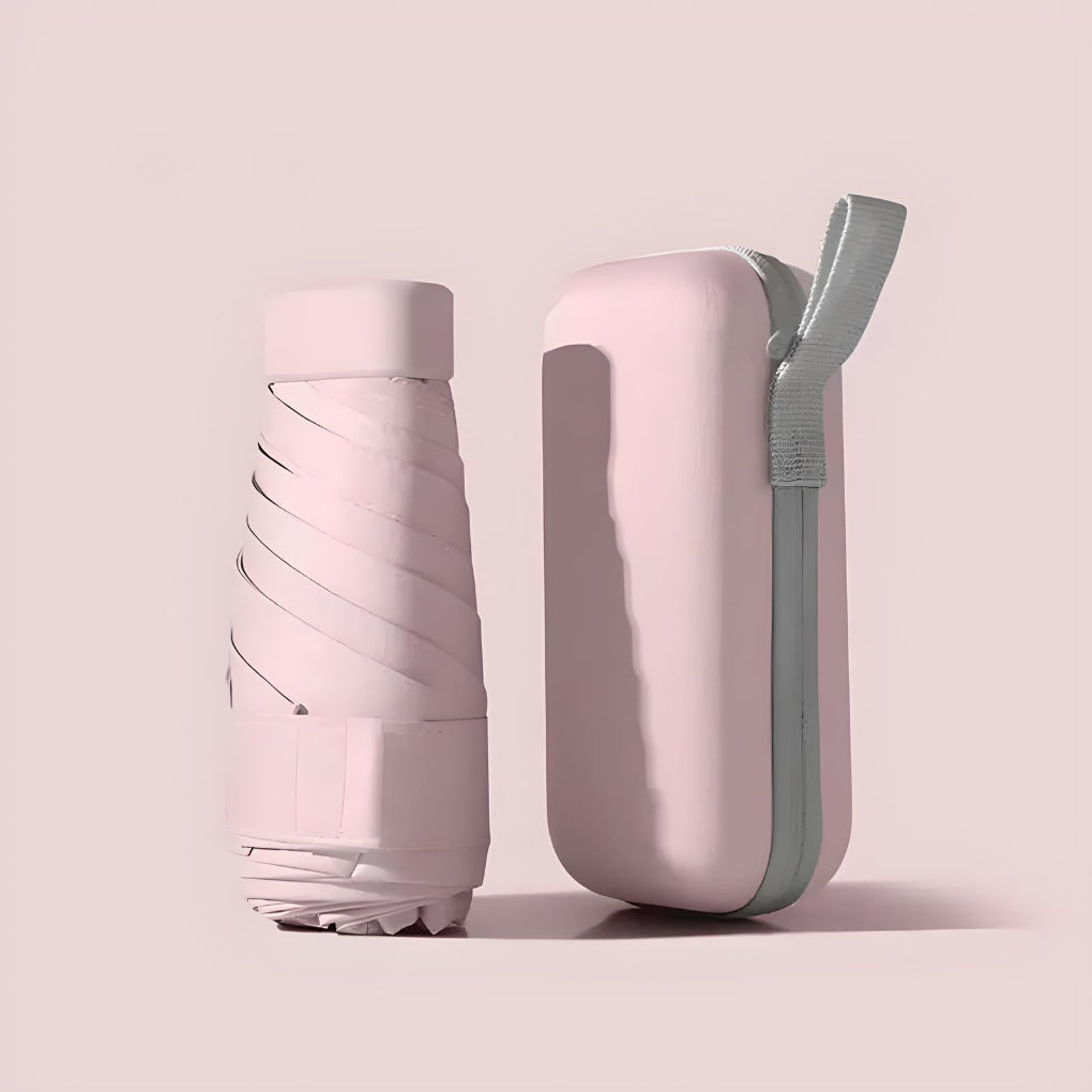 Hopfällbart paraply i handen som visar sin smidiga och lätta design