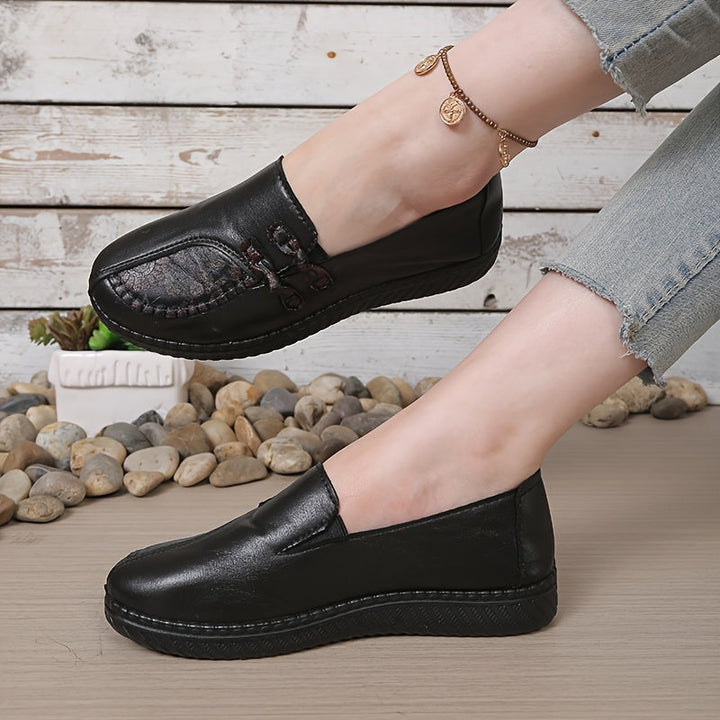 Mörkbruna dam skor i slip-on design med elegant rundad tå