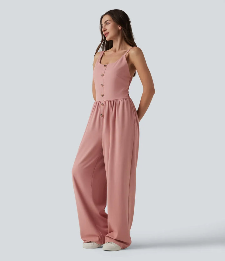 Sida av rosa ärmlös jumpsuit med vida ben på modell