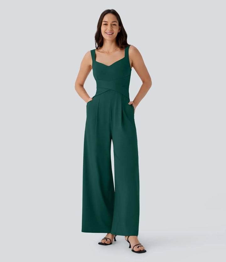 Stilren ärmlös jumpsuit med modern U-ringning bak och fickdetaljer