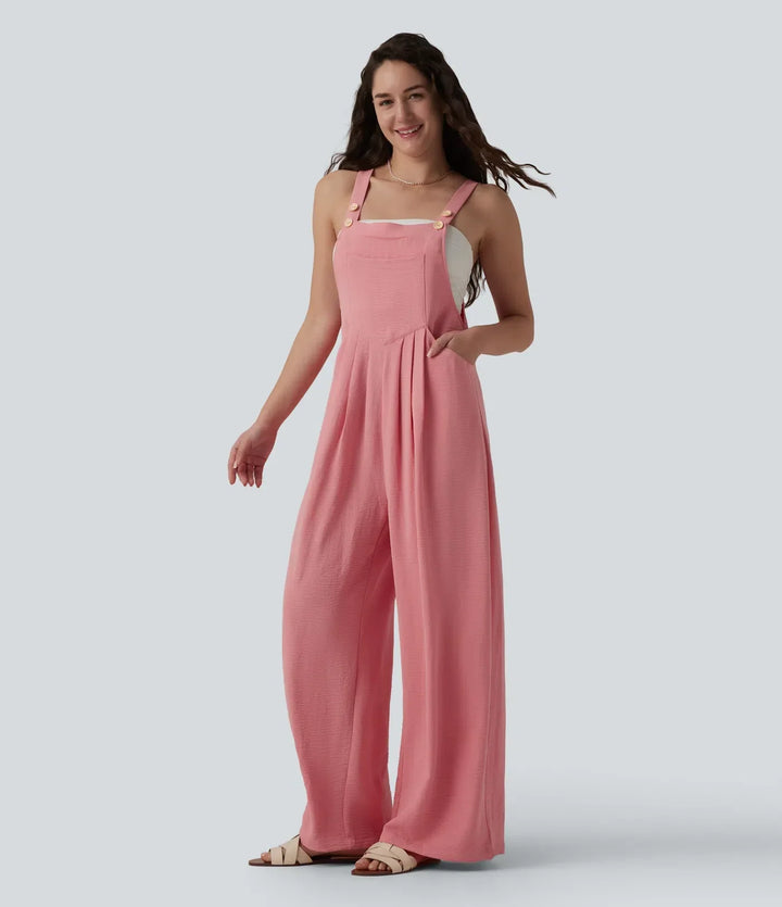 Modell som bär rosa overall med vida ben