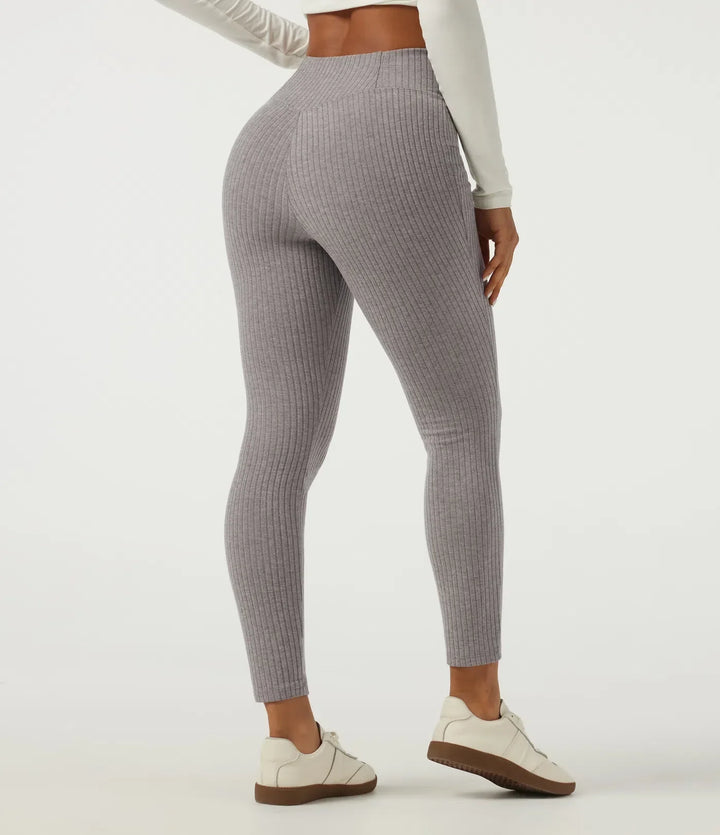 Högmidjade damleggings med dekorativ crossover och smarta fickor