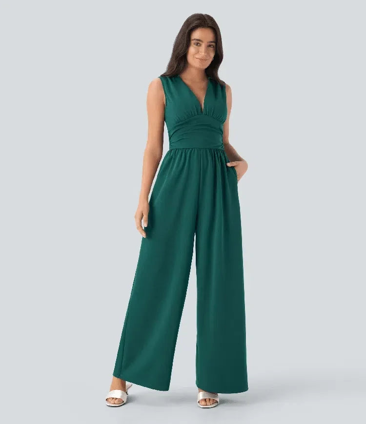 Kvinna som bär grön ärmlös jumpsuit framifrån