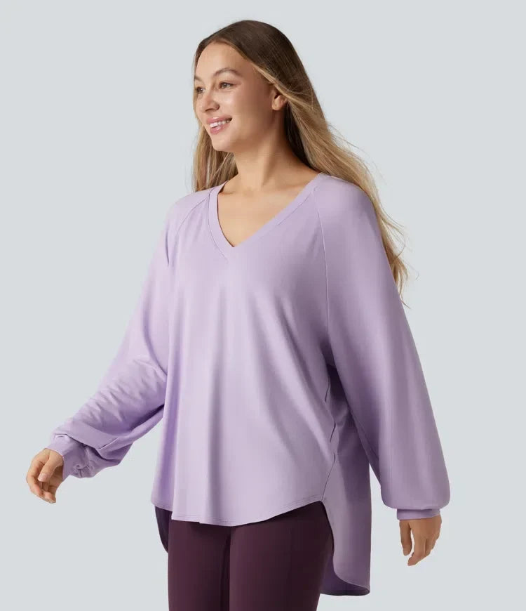 Damkläder - Långärmad lila sweatshirt med V-ringning sedd från sidan