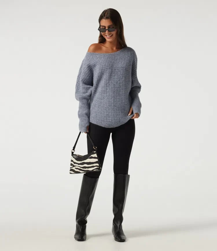 Bekväm damtröja i modetrend med praktiska tumhål