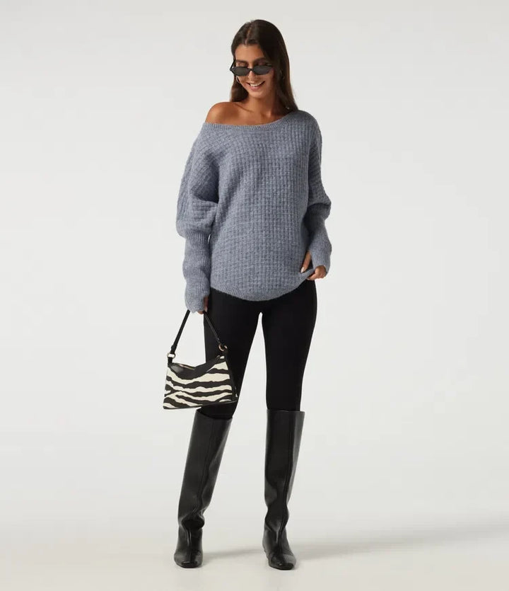 Bekväm damtröja i modetrend med praktiska tumhål