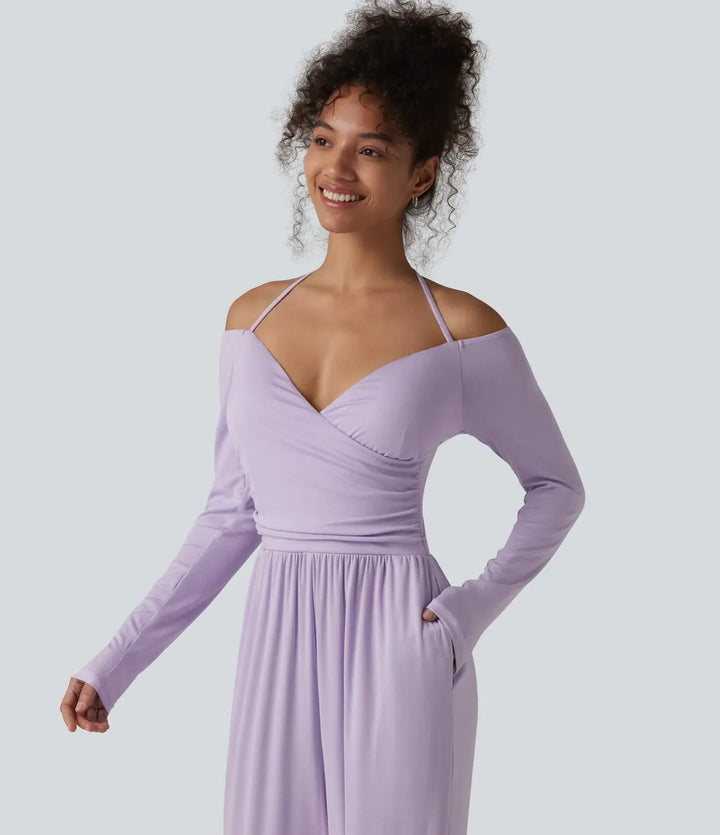 Svart ribbad jumpsuit med långa ärmar och praktiska fickor