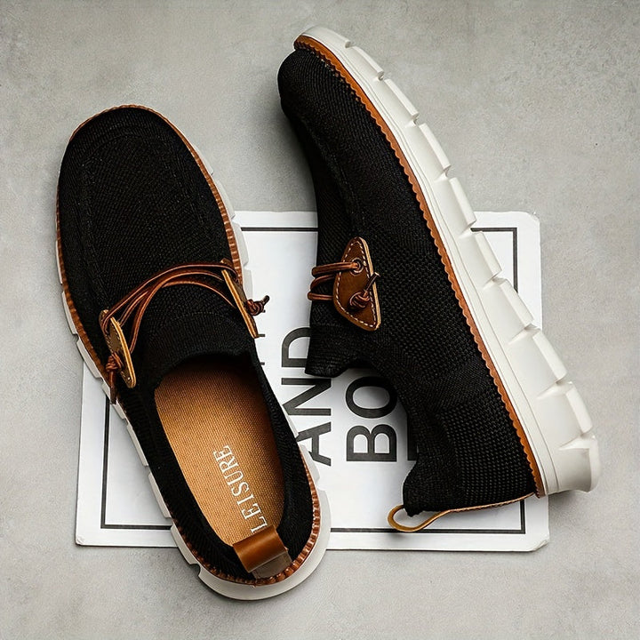 Hälvy av grå herr slip-ons för en sportig och ledig look