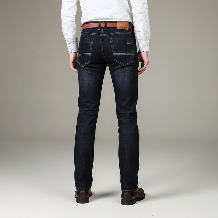 Baksida av mörka herr jeans med bruna detaljer