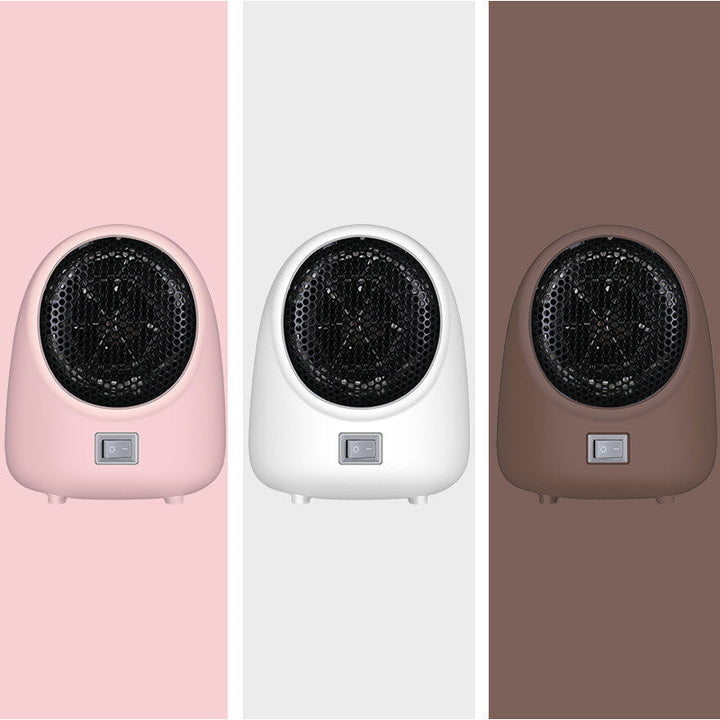 Kompakt mini värmare för hemmet, portabel fläktvärmare placerad på bord.