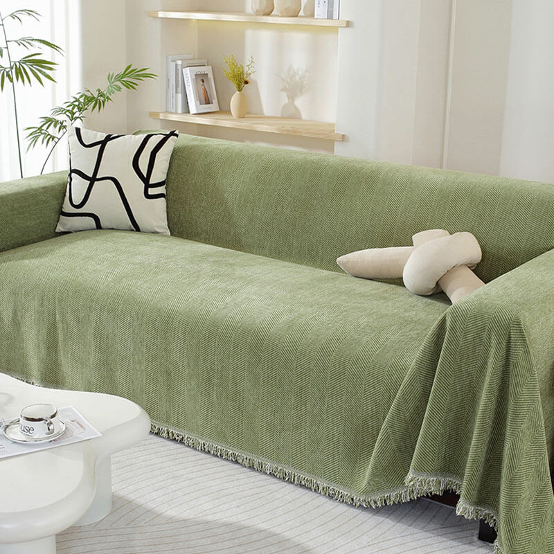 Sofföverdrag i textil med vackra tofsar, perfekt hemtextil för inredning