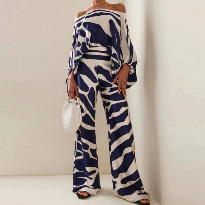Snyggt co-ord set för kvinnor vis bakifrån, off-shoulder tröja och vida byxor