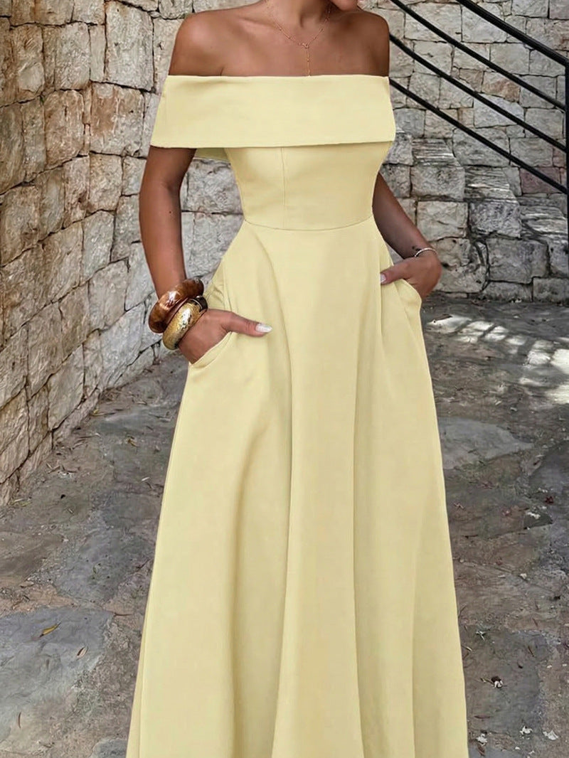 Lång sommarklänning med off-shoulder snitt och sköna fickor för dam