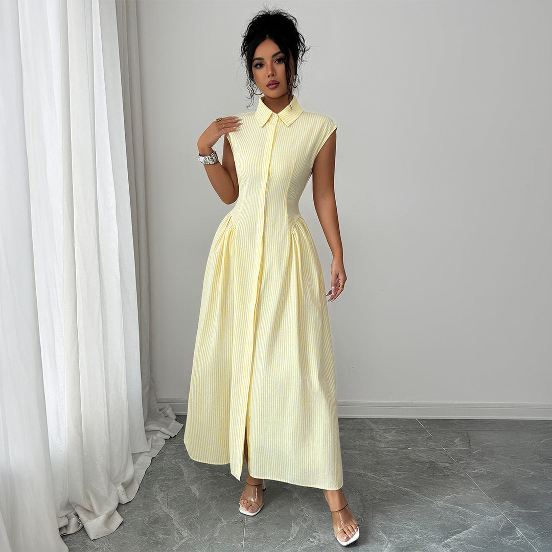 Stående porträtt av modell i gul ärmlös maxiklänning med krage