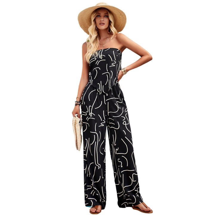 Mönstrad damjumpsuit med vida ben och axelbandslös design för fest och sommar