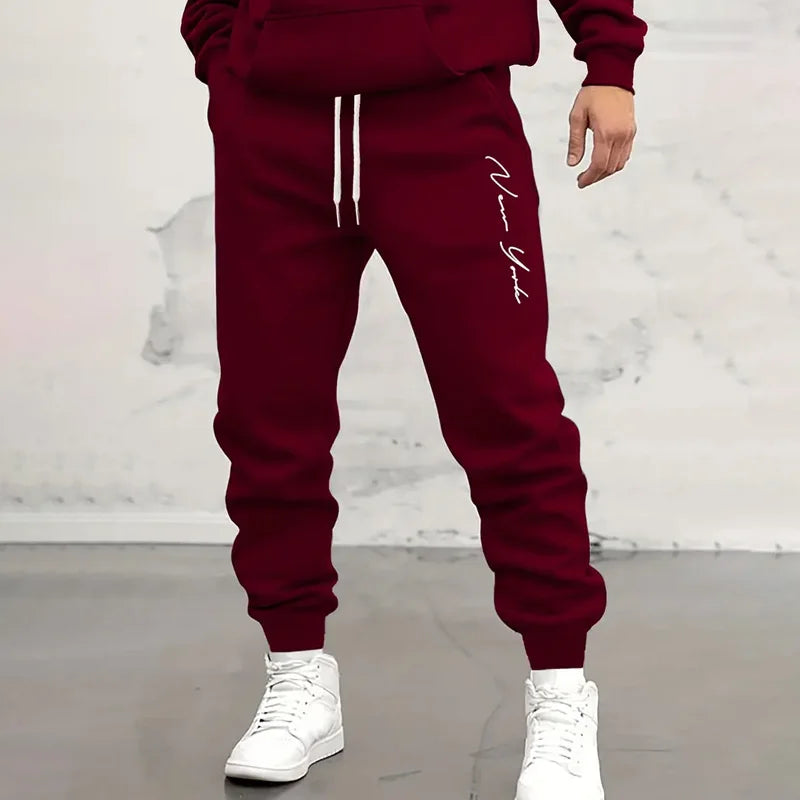 Svarta herr joggerbyxor med dragsko och tryck i streetwear-stil för en avslappnad look