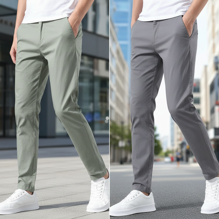 Man i ljusgröna och ljusgrå slim fit-byxor utomhus