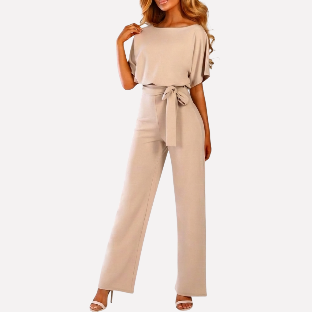 Snygg jumpsuit för dam med V-ringning och skärp visad bakifrån