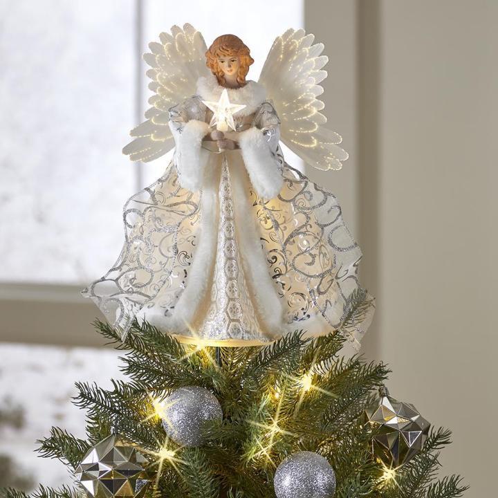 Animerad ängel som julgransspets med lysande stjärna