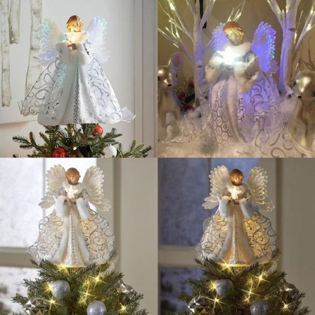 Närbild på julgransspets i form av en ängel med glittrande vingar och ljus