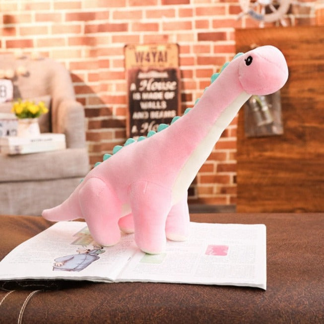 Rosa kramvänlig dinosaurie för barnrummet
