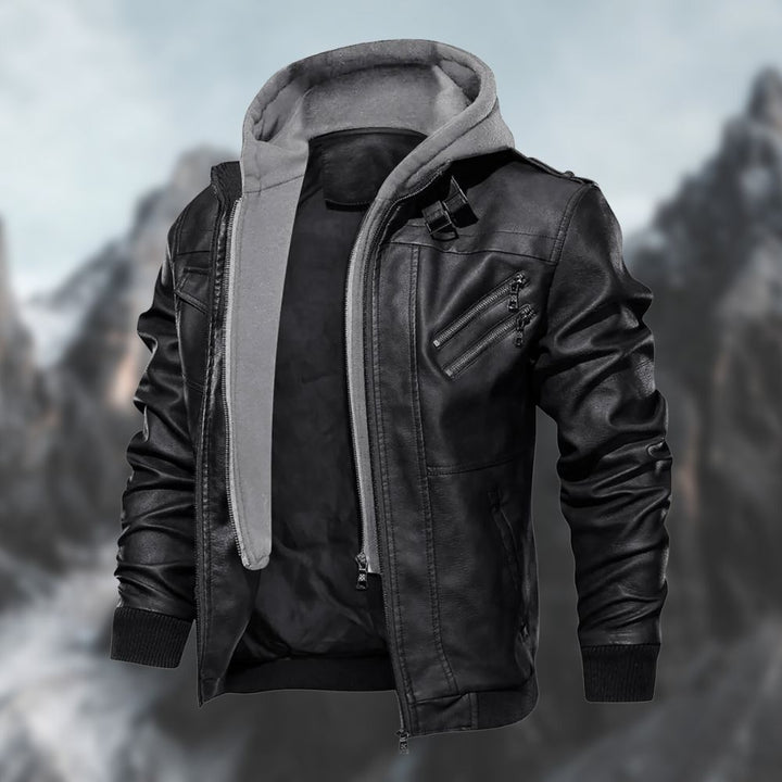 Svart herrjacka med slim fit design och huva framför bergsmotiv