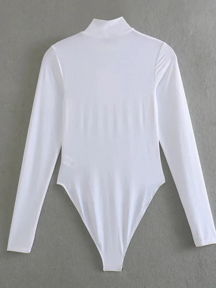 Baksida av vit långärmad bodysuit