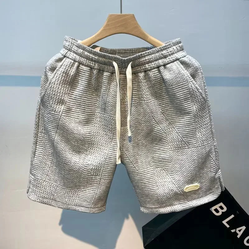 Milo herrshorts med svalkande teknik och fiskbensmönster i snygg design