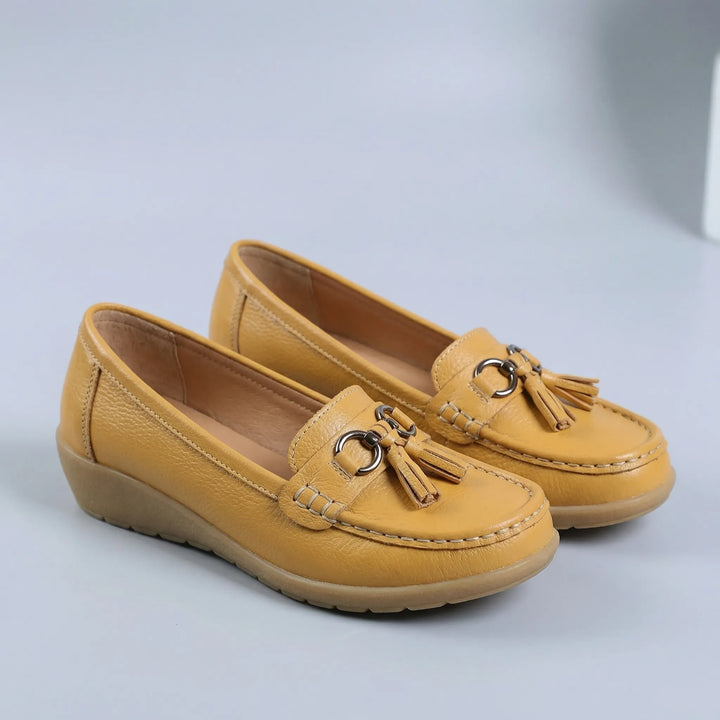 Snygga slip-on vardagsskor för dam i syntetmaterial med sula