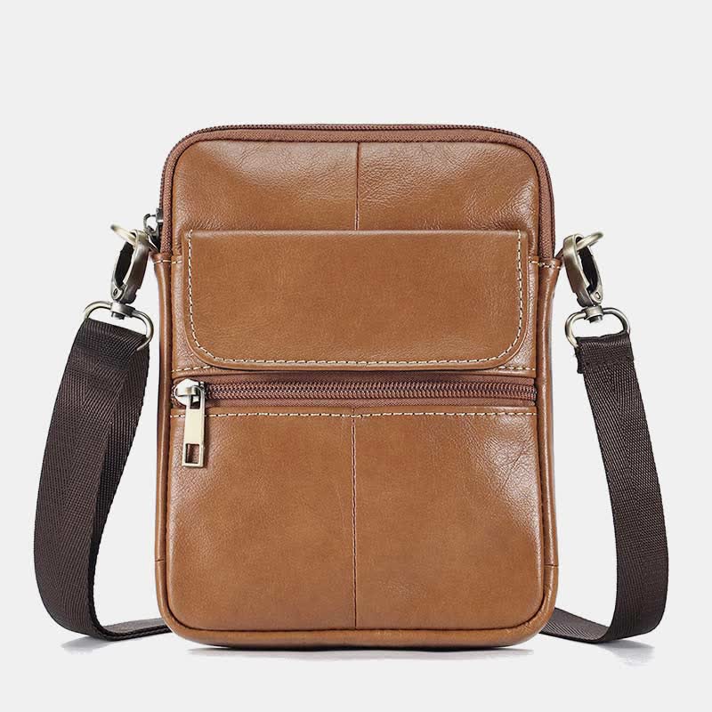 Man som bär snygg crossbody väska i stadsmiljö