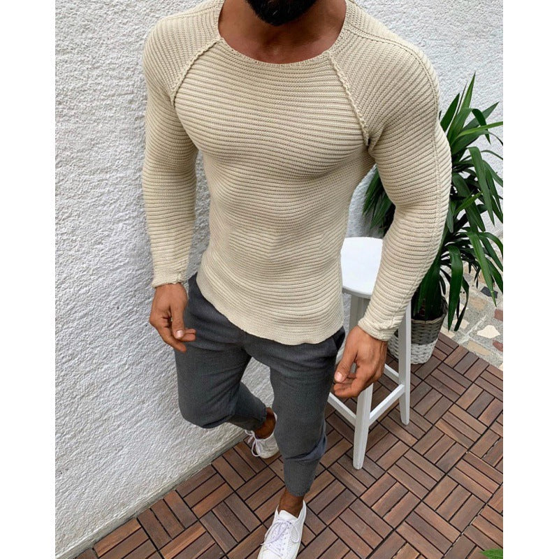 Slim fit herrtröja med lång ärm och rund hals i ribbad struktur