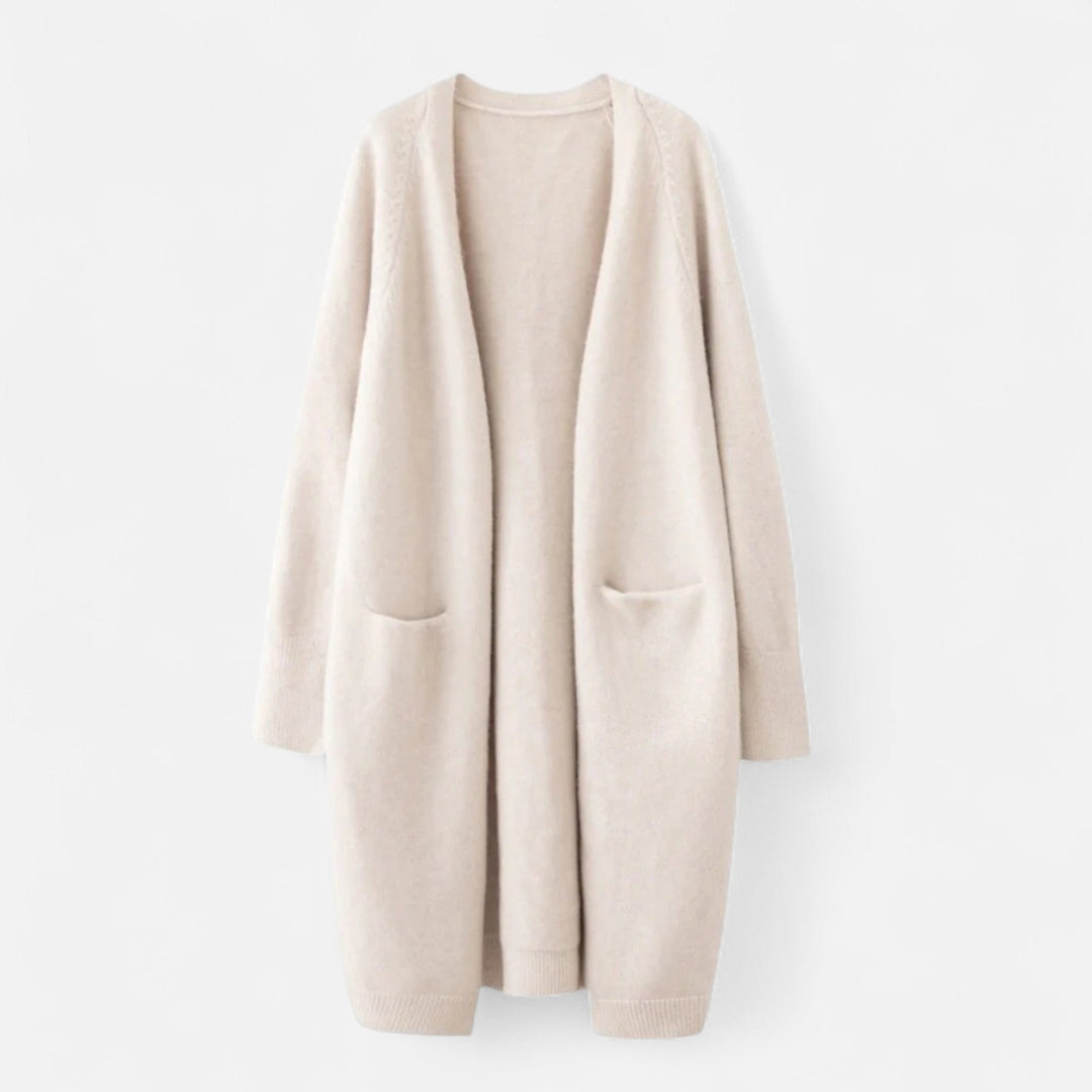 Beige damcardigan med öppen framsida och fickor mot vit bakgrund