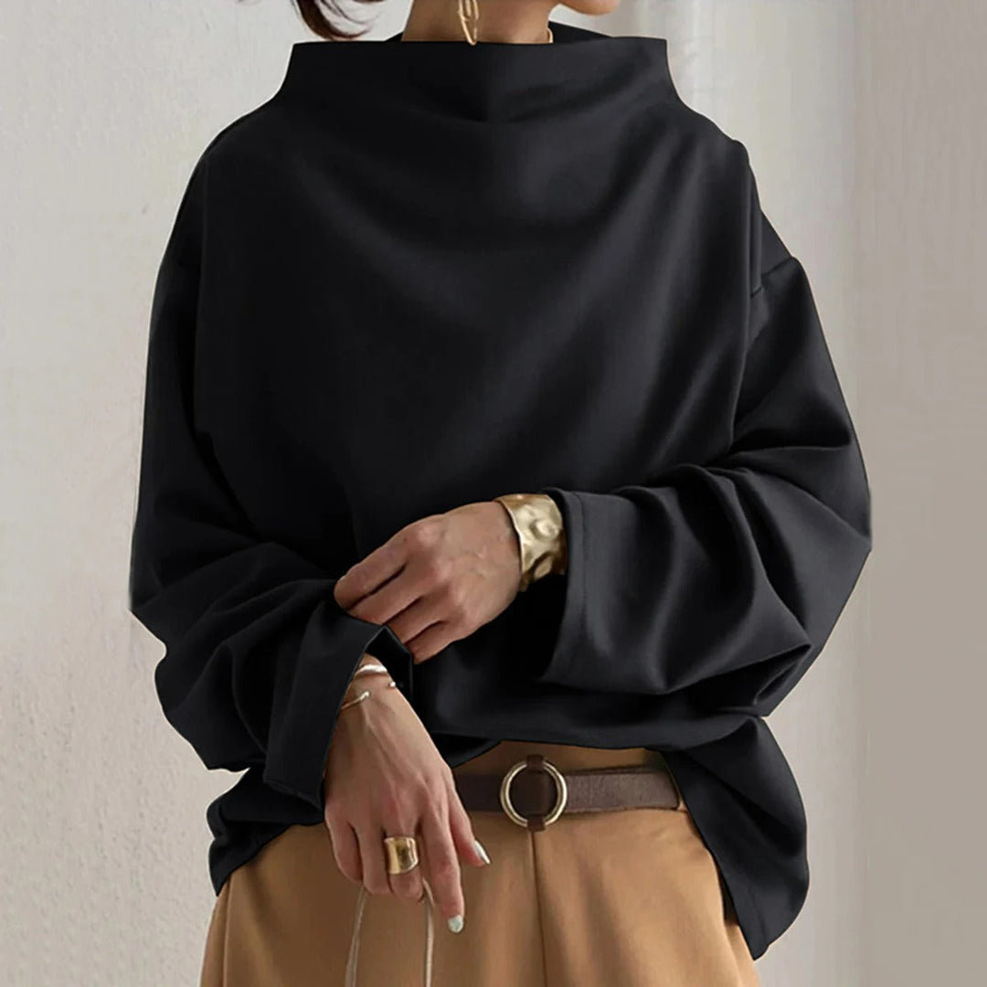 Oversized långärmad damtröja i svart tyg för höstmode
