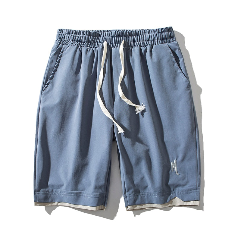 Blå herrshorts Dante med elastisk midja och praktiska sidofickor för sommarbruk