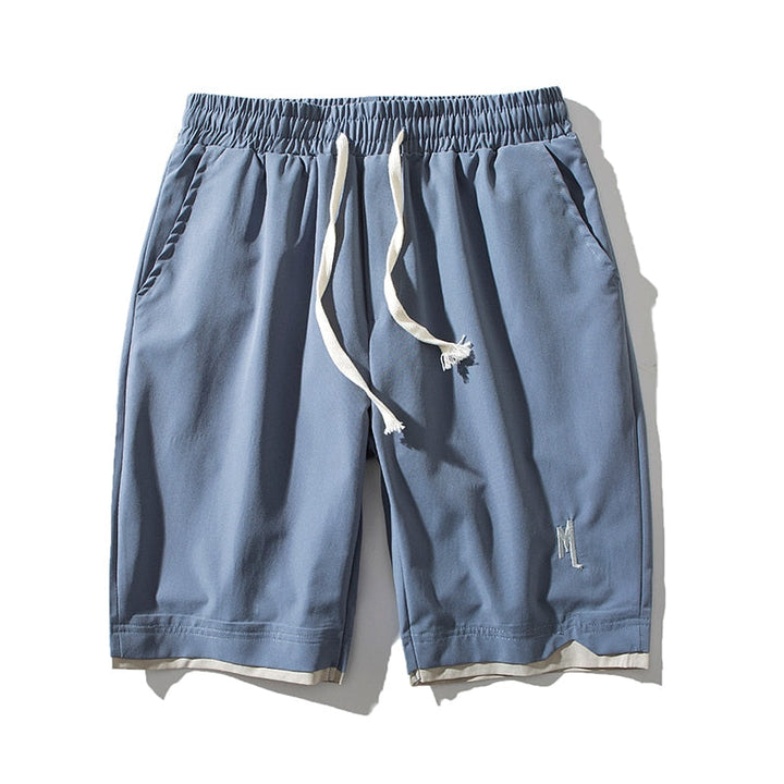 Blå herrshorts Dante med elastisk midja och praktiska sidofickor för sommarbruk