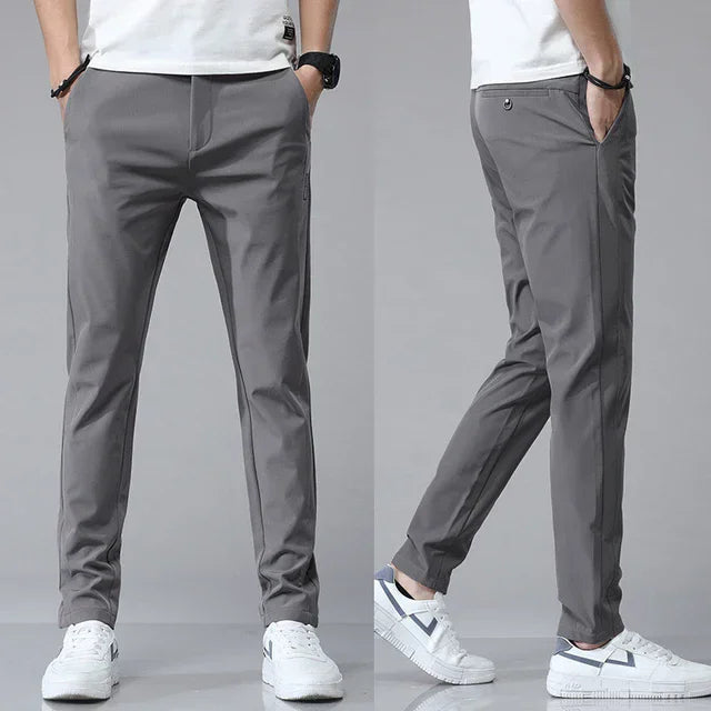 Detaljbild på tyg och sömmar för slim fit herrbyxor