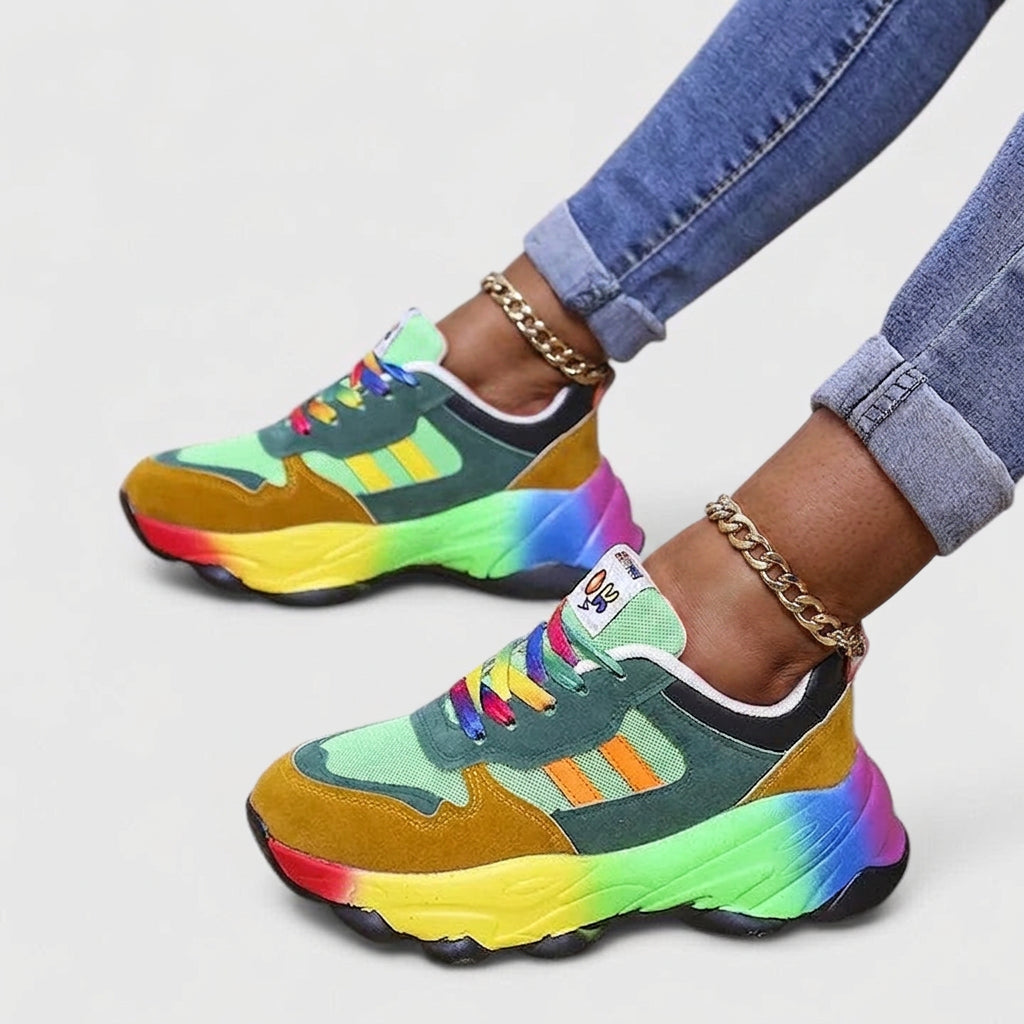 Marguerite gröna ortopediska sneakers med färgglad sula på fötterna