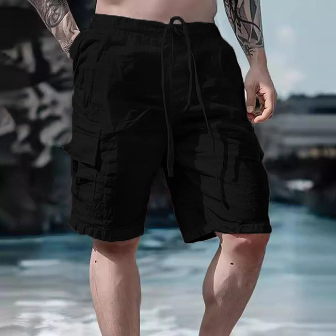 Herrshorts med vida ben i beige färg med justerbar dragsko för herre