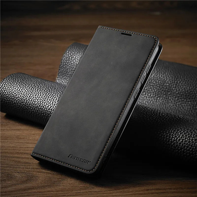 Svart läder plånboksfodral för iPhone stängt på mörk bakgrund