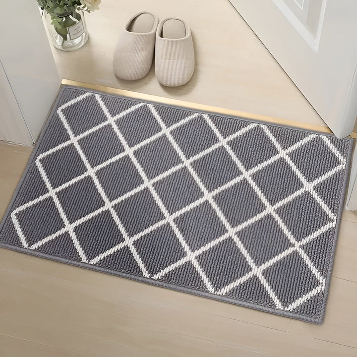 Helhetsbild av en stilren dörrmatta som skapar ordning i tamburen