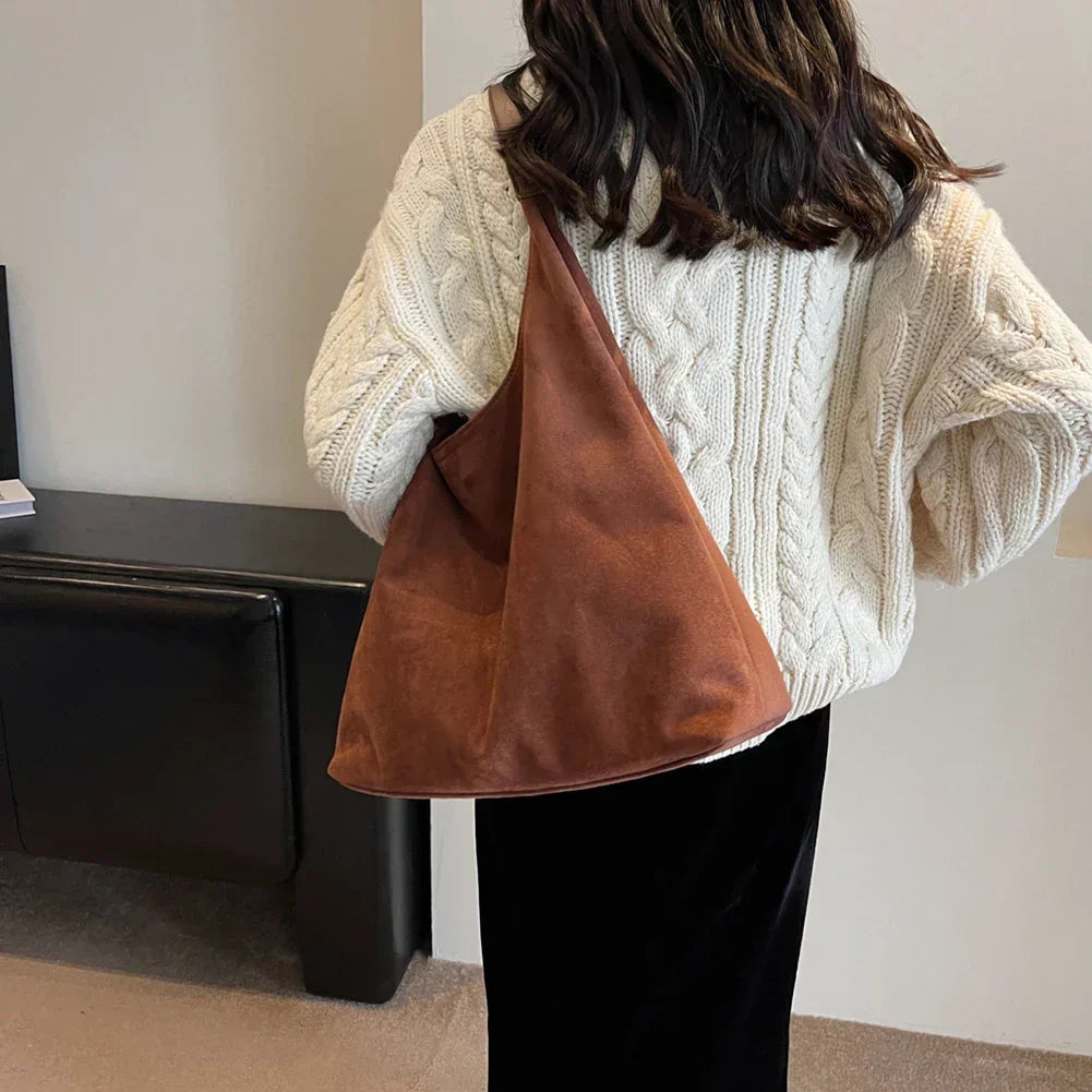 Elegant handväska och tote för damer med detalj på handtaget