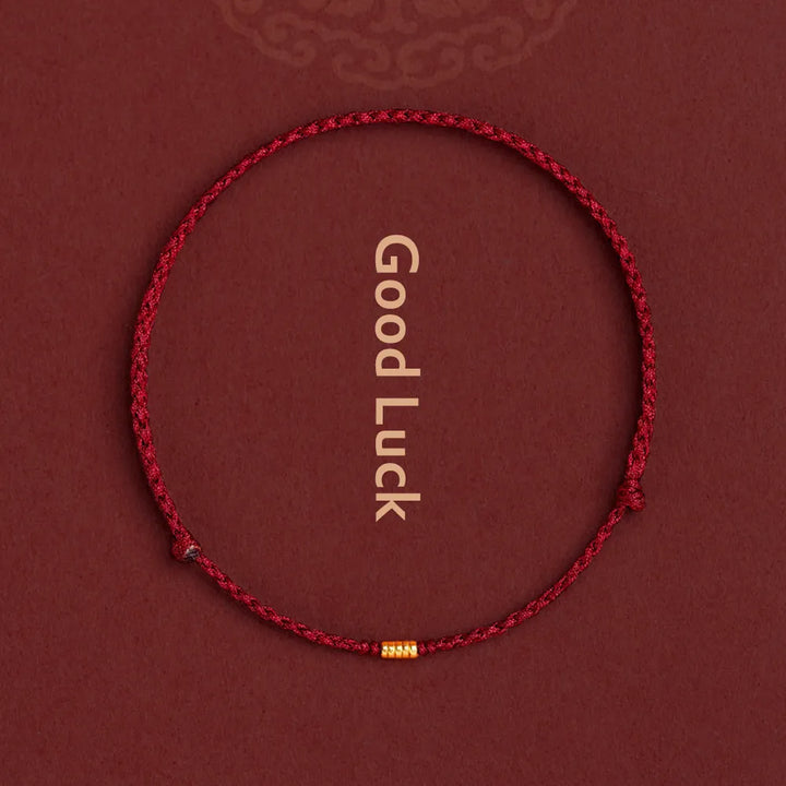 Rött Kabbalah skyddsbead armband med guldfärgade detaljer