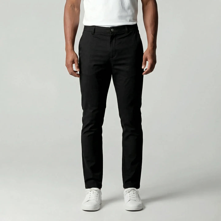 Mörkblå avsmalnande herrbyxor i slim fit stil för en modern och elegant look