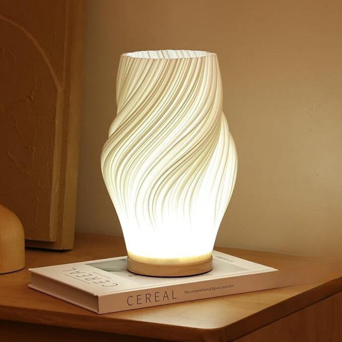Detaljbild på lampfoten och strömbrytaren till denna eleganta LED-lampa
