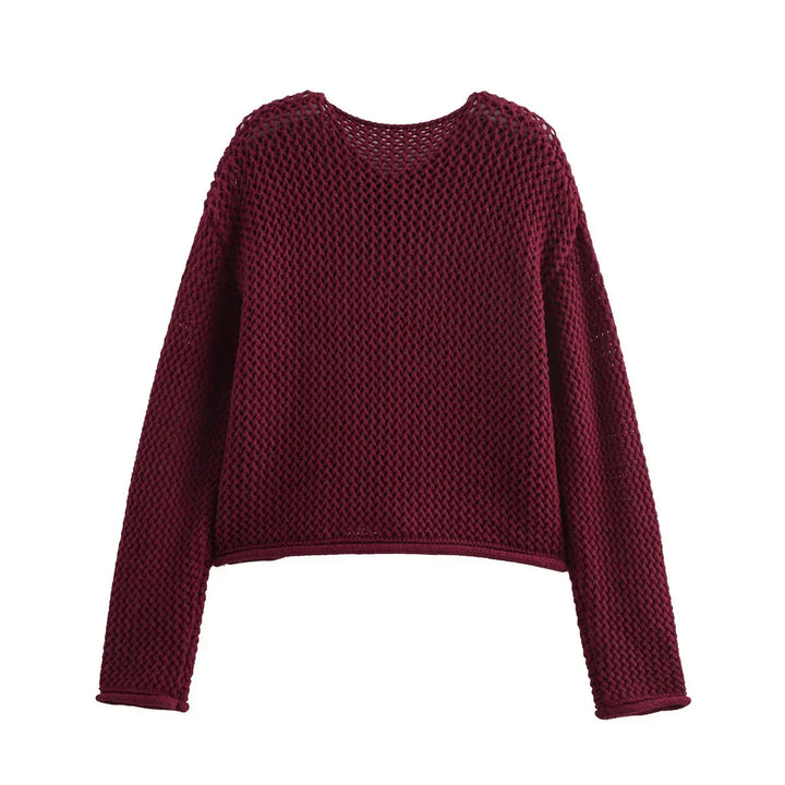 Marinblå damcardigan i stickat material med eleganta gulddetaljer