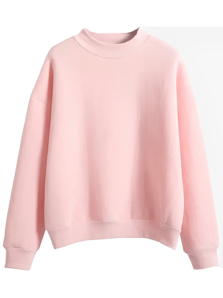 Beige damtröja med rund hals och lång ärm i oversize modell