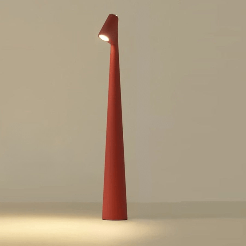 Röd trådlös LED bordslampa med stämningsfull belysning på yta