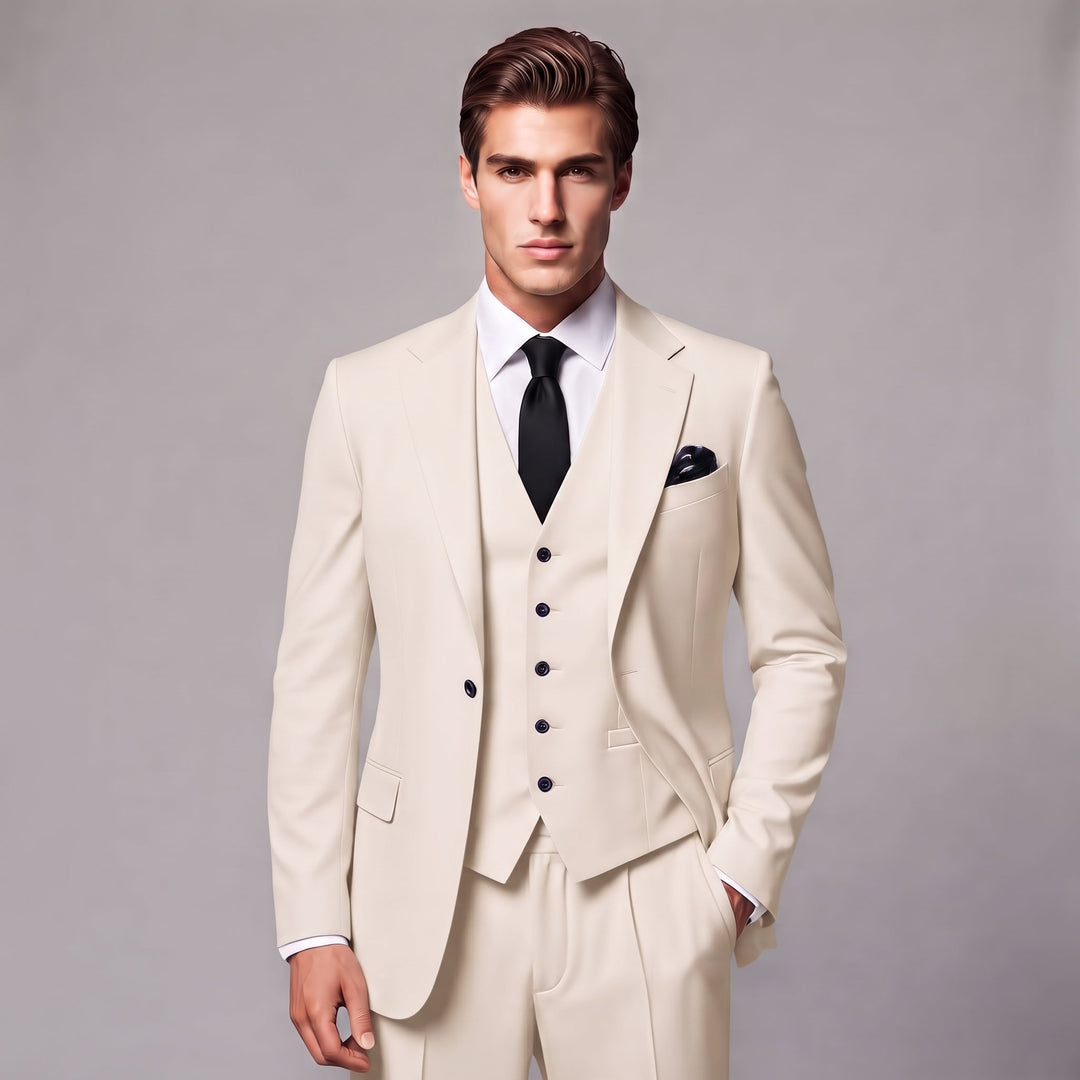 Man iklädd elegant beige tredelad kostym med slips