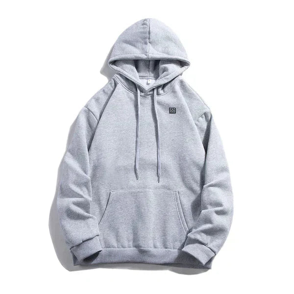 Grå unisex värmehoodie med dragkedja och fickor framifrån