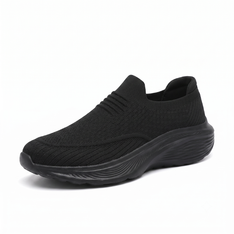 Svart unisex slip-on komfortsko med stötdämpande sula mot vit bakgrund